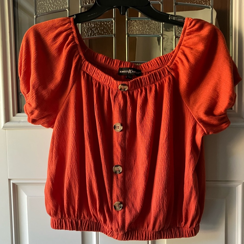 Gently used- Junior large tangerine colored short sleeve crop top